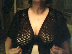 Amateur mature short haired bitch in knitted black nightie shows huge tits