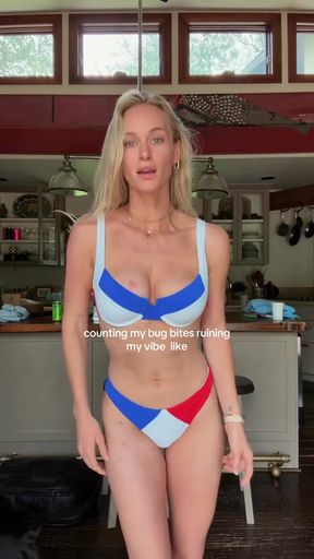 Busty bikini babe shows off her big tits