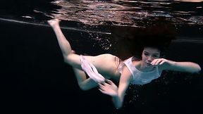 Skinny and petite bitch underwater exposes her body