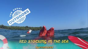 Red Stocking in the Sea at the Outdoor Beach