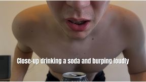 Close-up drinking a soda and burping loudly
