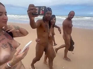 Friends go to the nude beach to give it to the hot guys.