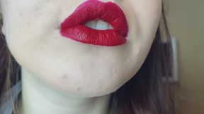 put on red lipstick close up view