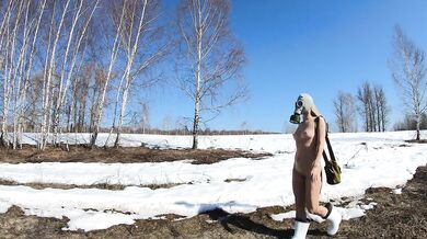 Blonde Russian exhibitionist strips in gas mask