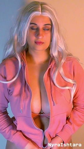 Busty blonde unzips her hoodie to tease her enormous chest in a pink bra
