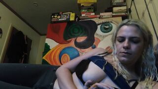 Beauty blonde smokes clove cigarettes, plays on phone and plays with hooters
