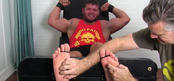 Hunky muscular dude endures tickling from m