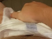 Playing with my freshly filled diaper