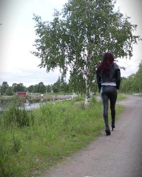 Walking in full leather outfit and heels.
