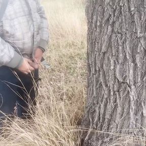 Pissed under a tree. Lots of piss from big cock