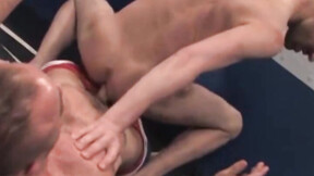 Over on the wrestling mat, RSS exclusive Taurus, in a tight blue singlet, & Ju