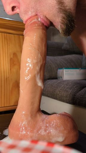 Close-up gagging on dildo