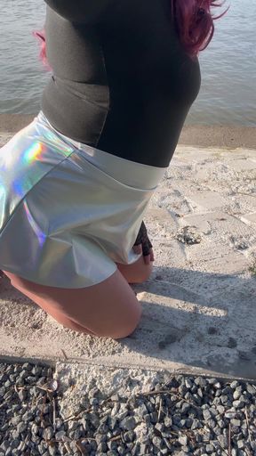 Sissy in miniskirt and chastity with big dildo outdoor