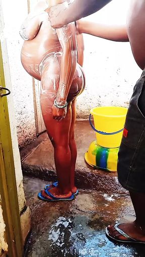 Outdoor bathing my pregnant girlfriend in dirty environment.