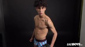 ”Curly twink boy shows off his slim body on webcam”