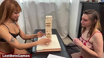 Two teen lesbians playing a Strip Tall Tumble Tower game