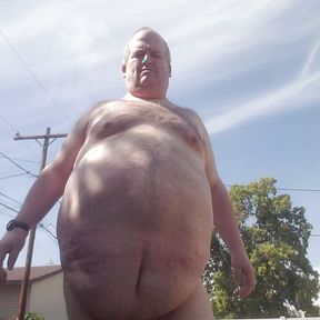 Fat guy getting naked outside