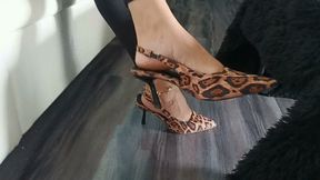 Wonderful woman keeps her stiletto heels dangling on her feet (8)