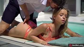 A guy joins his blonde friend on the side of the pool.He removes her top then fingers her ass.The teen blowjobs him then bends over for an anal sex.