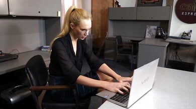 Blonde submissive bound and gagged by dominant brunette in office BDSM session