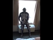 skeleton jerking off at hotel window watching truck drivers get ready for work