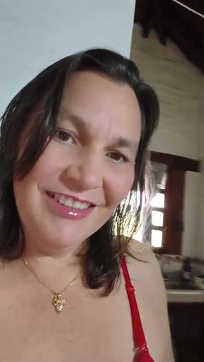 A mature woman Milf is home alone and rubs her pussy with her dildo.