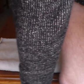 John is taking a big piss on the towel on the table