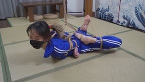 xr288-A rope, hogtied, a gag and toes tied.