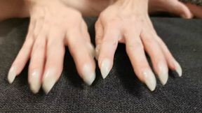 Pointy natural nails scratch fabric