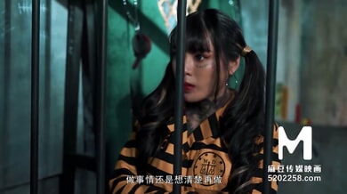 Ai Qiu plays a submissive prisoner in a naval interrogation scene with spanking and gagging