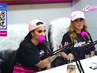 Flavia Oliver performs oral sex on Natasha Steffens during the recording of the California Podcast