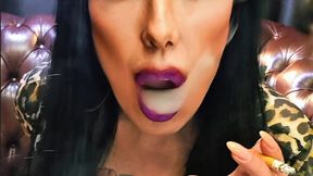Smoking sensually, wearing a long leopard-print dress – Dunhill International Cork Filter