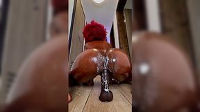 Big ebony ass squirting on the big black dildo till her pussy's creamy