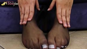 Blonde shemale shows her feet in black nylons