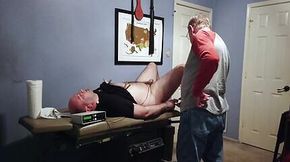 Sir G gives me a medical exam before hooking up the electro to my cock and butt while spanking me