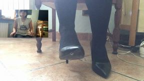 "Elegant Toe Tapping in High Heels While Sitting"