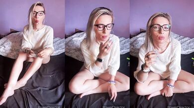 sexy girl in glasses smokes a cigarette