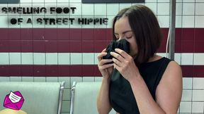 Smelling foot of a street hippie HD