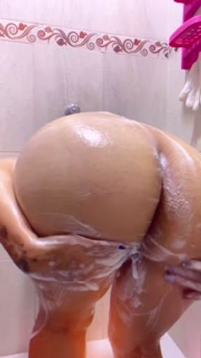 Sensual woman bathes, vagina, anus, tits, soap and water