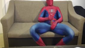 Horny Spiderman jerks off and cums massive load