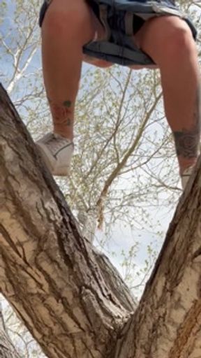 Piss Slut climbs up a tree to piss off branch!