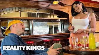 Mona Azar the waitress serves herself to a customer in the car