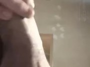Standing, undressing and pulling cock Fire Boy