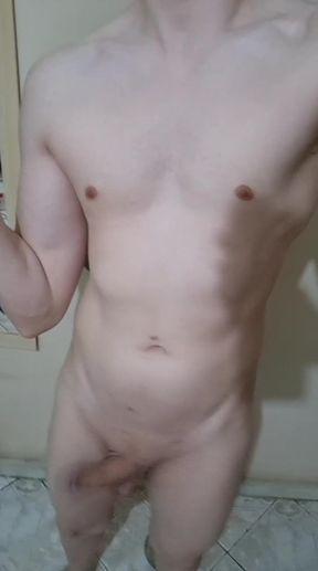 Slim twunk shows off his cock while dancing