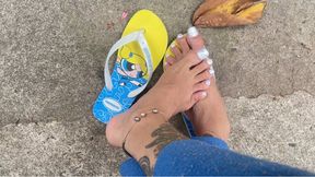 walking barefoot on the street with new nails
