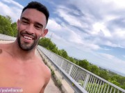 Fit guy gets naked next to a highway on a bridge. Very Risky!