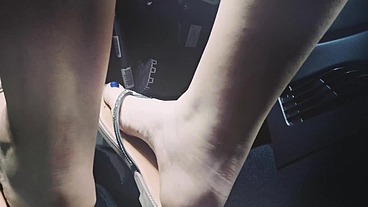 Driving in flip-flops and pedaling blue nail polish