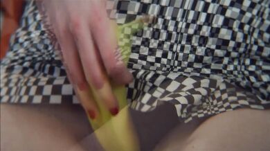 Punk girl with dyed hair deep throats her banana in transparent mini skirt