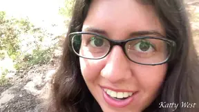 Naughty girl in glasses strokes her 18 year old pussy in public