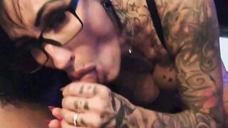 German milf with black hair tattoos and glasses gives POV blowjob